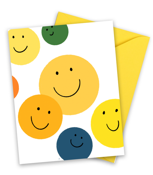 yellow, green, blue and orange smile faces on a greeting card, blank inside