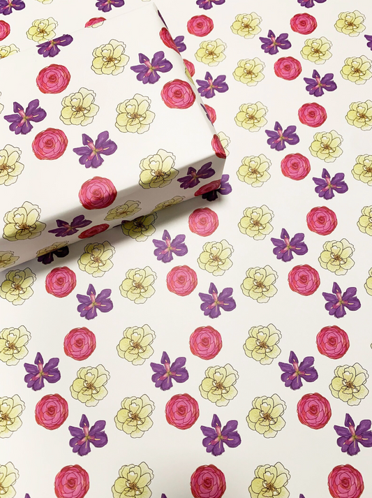 pink purple and yellow illustrated flowers on wrapping paper