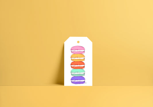 gift tag that has stacked macarons in pink, yellow, orange, mint and purple. 