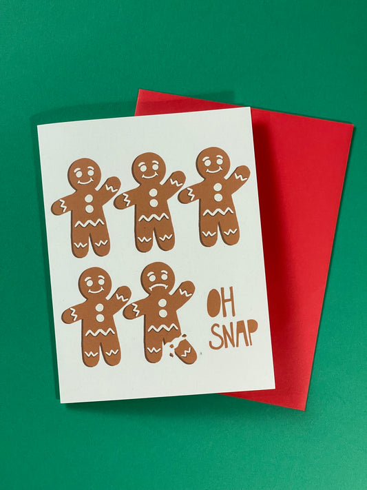 holiday greeting card with gingerbread that reads oh snap on the front and its the holidays inside.