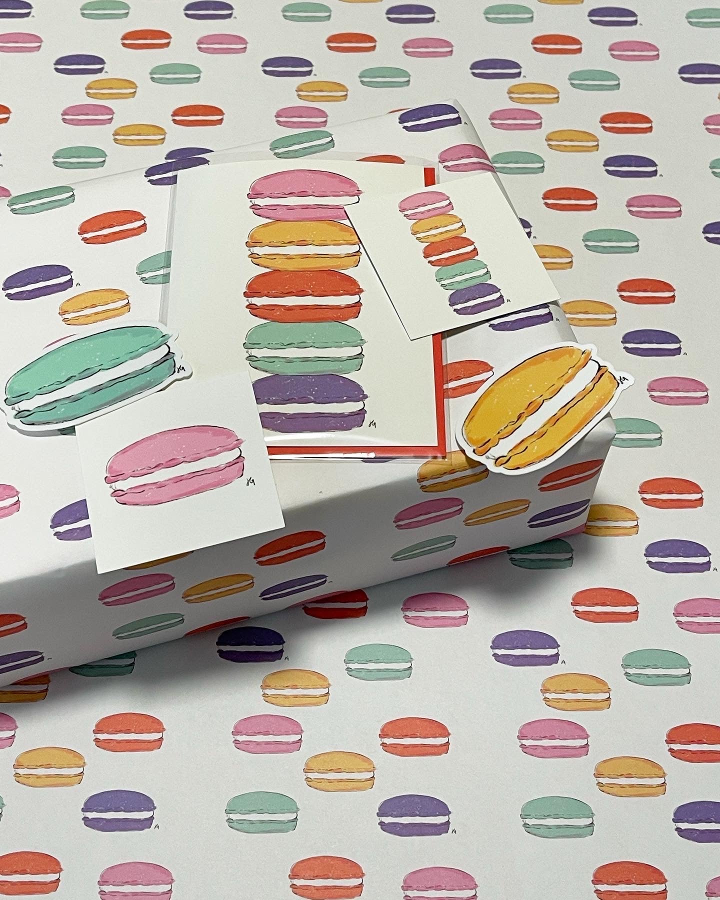 macaron suite of stickers, cards, wrapping paper. Each includes the colors pink, purple, mint, orange and yellow