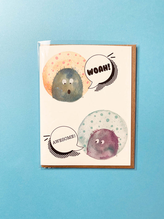 greeting card with illustrated monsters that say Woah! and Awesome. Blank inside