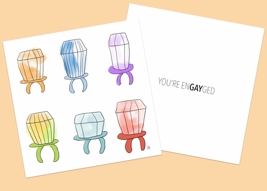 Square greeting card with illustrated rings inspired by ring pops in pastel colors that reads you're engayged inside